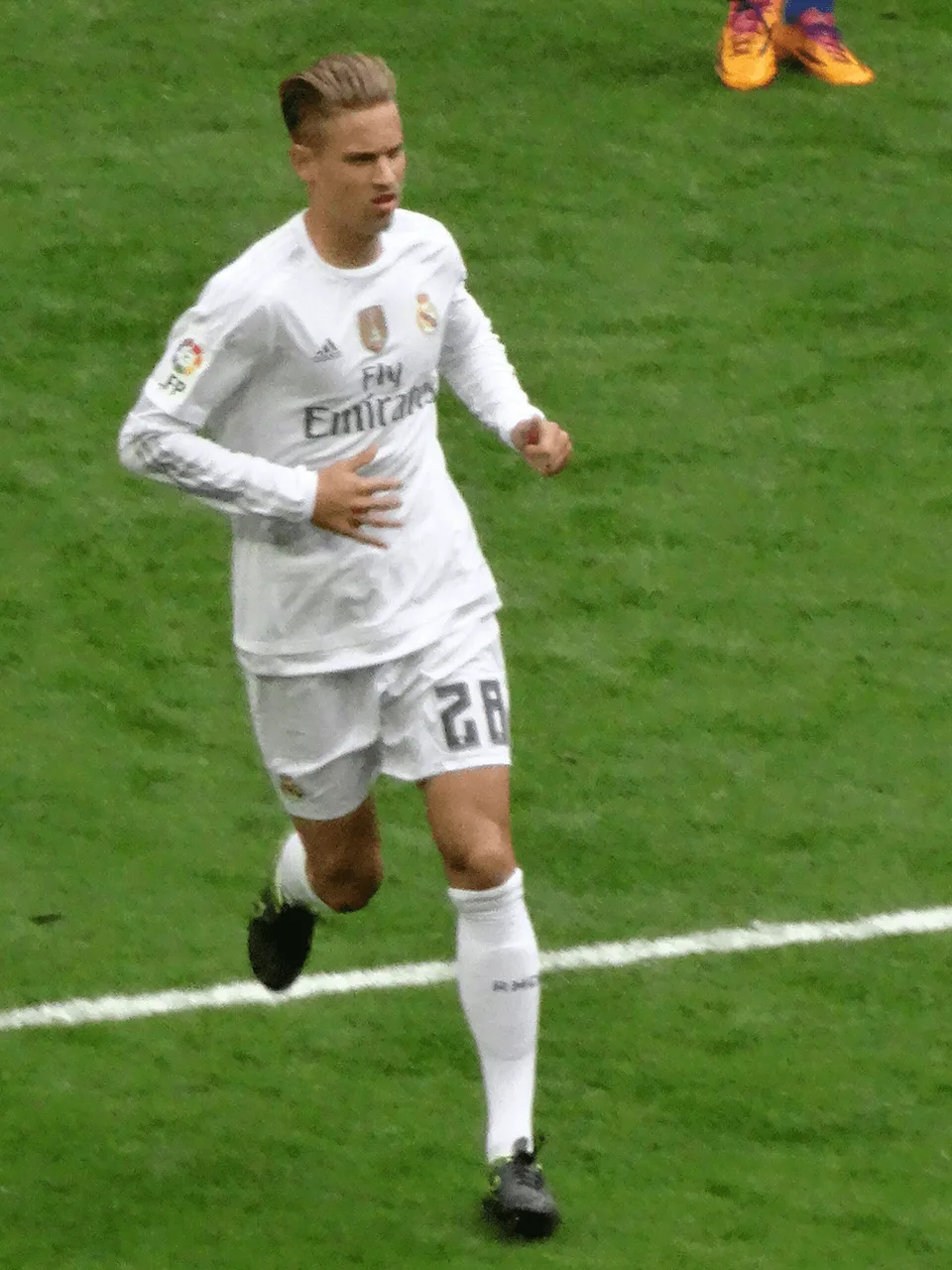 Marcos Llorente, del Atlético de Madrid, corriendo durante un partido
