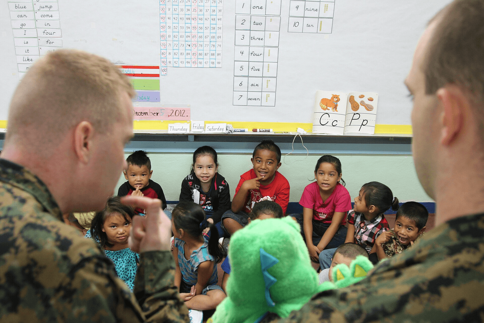 Public-domain image showing U.S. Marine Corps dental personnel teaching children proper brushing and oral hygiene